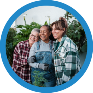 Three Happy Women Gardening at Evelyn's House Foundation - Empowerment and Healing