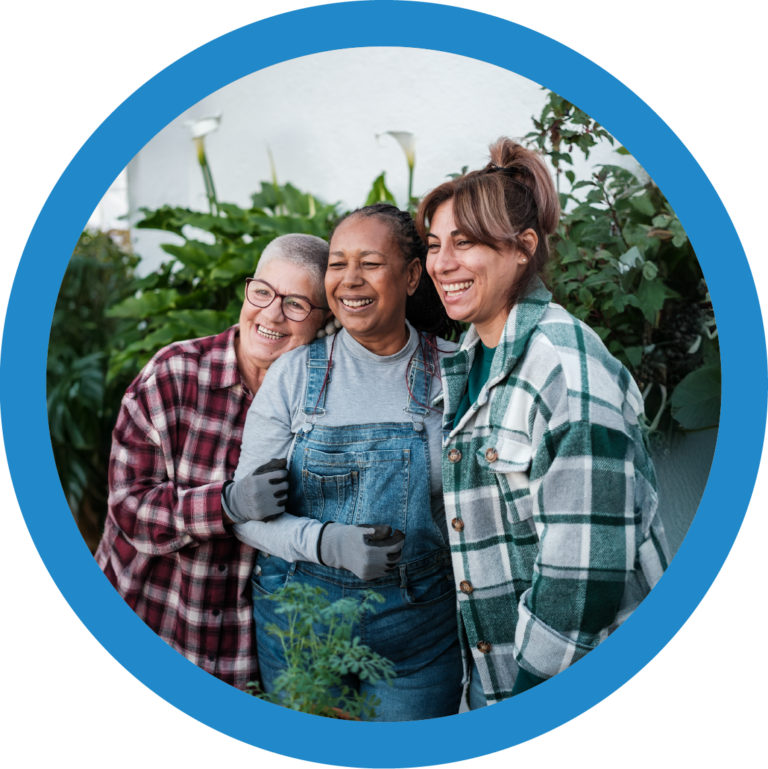 Three Happy Women Gardening at Evelyn's House Foundation - Empowerment and Healing